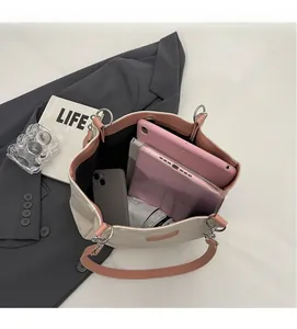 Interior view of large capacity tote bag with tablet and folding umbrella storage