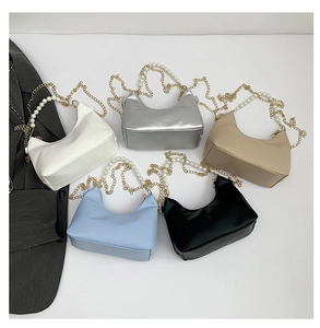 Detailed collection of pearl chain half-moon bags in white, silver, khaki, blue, and black