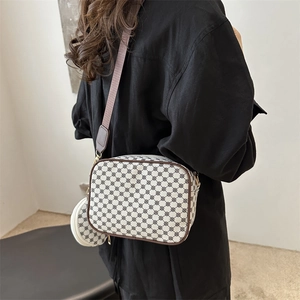 Chic vintage plaid crossbody square bag with a matching round coin purse on a model