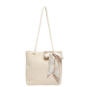 Large beige woven straw tote bag with rope handles and heart print silk scarf detail