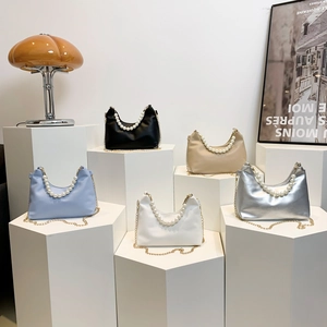 Elegant half-moon underarm bags with pearl handles and gold chain straps in five colors