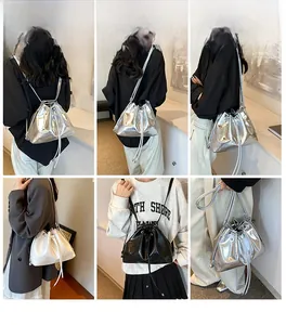 Detailed views of drawstring bucket bags in silver, white, and black leather finishes