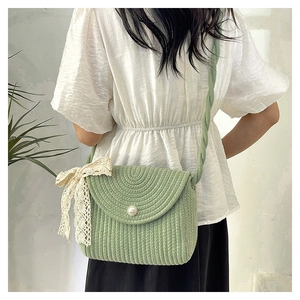 Light green knitted crossbody bag with pearl button and lace bow for women
