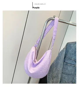 Detail of light purple bubble fabric shoulder bag with unique pleated texture design