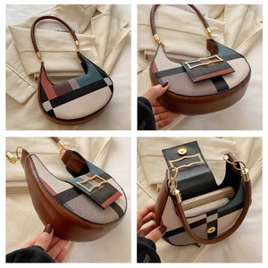 Detail view of contrast geometric saddle bag with leather strap and golden magnetic buckle