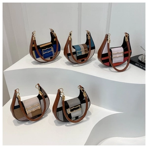 Five stylish checkered crescent saddle bags in assorted colors with brown leather handles