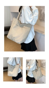 Close-up of beige waterproof oxford tote bag featuring multi-pocket design and large capacity