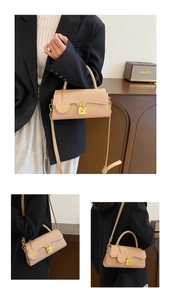 Detail view of beige PU leather handbag featuring gold clasp and removable shoulder strap