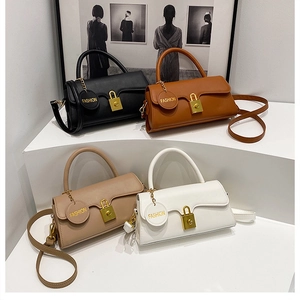 Group shot of chic crossbody bags in black, brown, beige and white with gold locks
