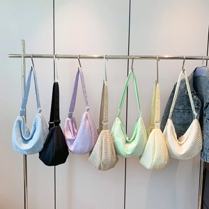 Chic dumpling tote bags in multiple colors with pleated texture and top zipper closure