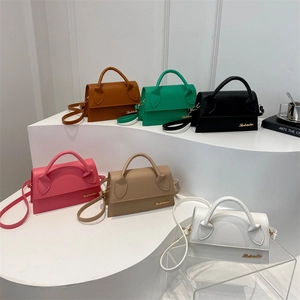 Stylish leather crossbody bags in six colors displayed on white stairs for women