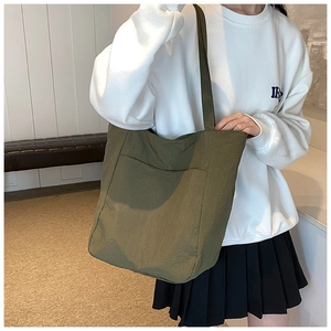 Olive green nylon tote bag with large capacity and outer pocket for casual daily use