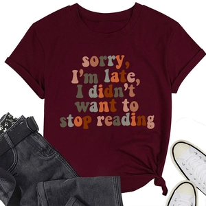 Close-up of 'Sorry I'm late' reading quote on burgundy cotton crew neck t-shirt