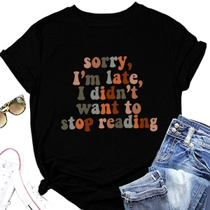Detail view of black t-shirt with retro sorry i'm late i didn't want to stop reading print