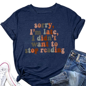 Detail of navy blue t-shirt with Sorry I'm Late vintage text print and soft cotton texture