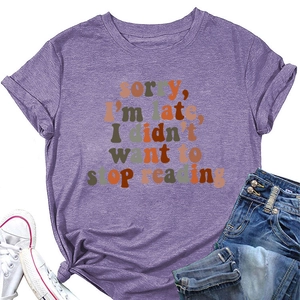 Detail of purple cotton T-shirt featuring Sorry I'm Late I Didn't Want to Stop Reading print