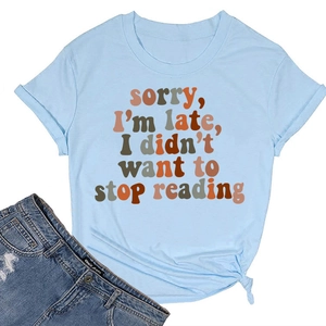 Detail view of cotton t-shirt fabric with Sorry I'm Late I Didn't Want to Stop Reading text