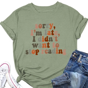 Close-up of sage green T-shirt featuring retro slogan print and stylish front hem knot