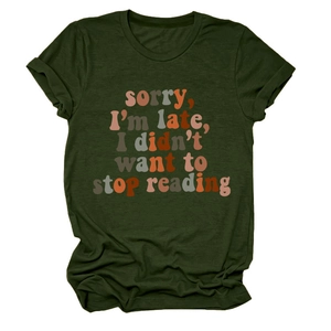 Detail of dark green t-shirt with Sorry I'm late I didn't want to stop reading print