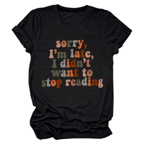 Detail of Sorry I'm Late I Didn't Want to Stop Reading print on black cotton T-shirt
