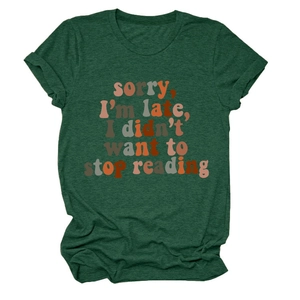 Detail of green round neck T-shirt with 'sorry I'm late I didn't want to stop reading' print