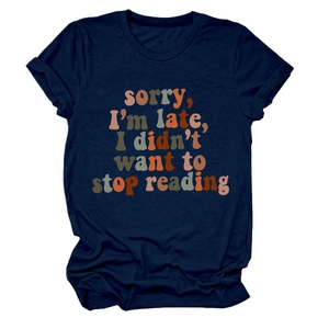 Detail of navy blue t-shirt with retro sorry I'm late I didn't want to stop reading text