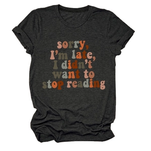 Detail of rolled sleeve and vintage lettering on charcoal gray cotton t-shirt