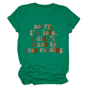 Close-up of green cotton tee with colorful Sorry I'm Late I Didn't Want To Stop Reading print