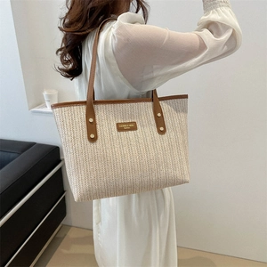 Large woven tote bag with herringbone pattern and brown leather straps for women