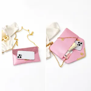 Pink glitter envelope evening bag showing spacious interior capacity for phone and items