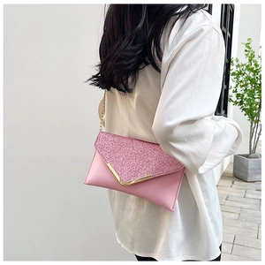 Pink glitter envelope clutch bag with gold V-metal trim and elegant chain strap detail