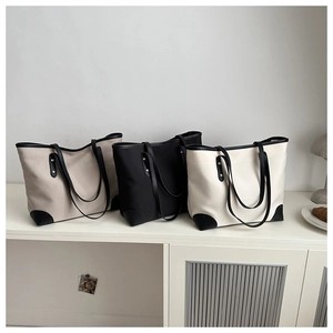 Three large canvas tote bags with leather trim in khaki, black and beige colors