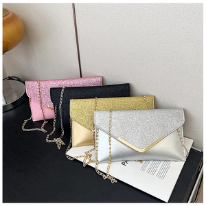 Detail of glitter sequins and V-shaped gold metal trim on elegant evening clutch bags