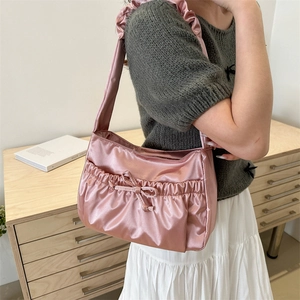 Pink satin hobo bag with pleated ruffles and bow drawstring detail for women