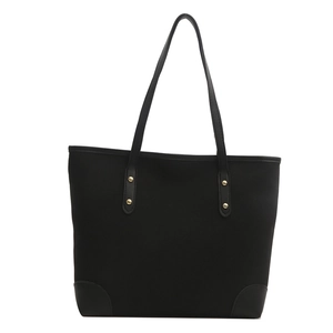 Bolso tote negro minimalista de gran capacidad con remaches dorados y detalles de cuero