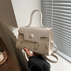 Chic woven straw handbag with floral embroidery and white leather flap for women