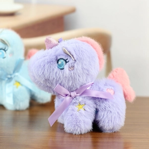 Close-up of soft purple plush unicorn keychain with pink mane and yellow star embroidery