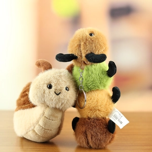 Detailed view of plush snail and caterpillar keychains with soft textures and embroidery