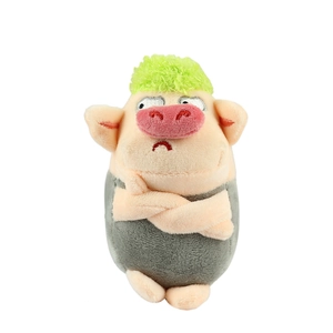 Lustiger grüner Plüschschwein-Schlüsselanhänger mit griesgrämigem Gesichtsausdruck