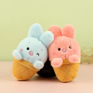 Detail of plush rabbit ice cream pendants in soft blue and pink faux fur textures