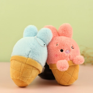 Detail view of plush ice cream bunny charms with textured cones and metal chains