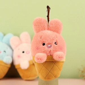 Detail of cute coral pink plush rabbit in a brown ice cream cone with beaded keychain link