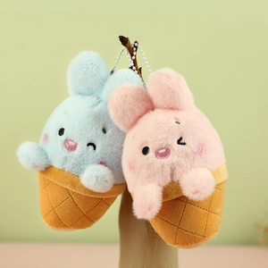 Detail of plush bunny ice cream cone keychains in pink and blue with silver bead chains