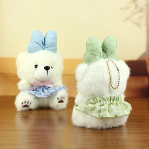 Detailed front and back view of plush bear keychain with plaid skirt and metal chain