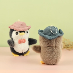Cute penguin plush keychain with velvet hat and bow decoration for bag accessory