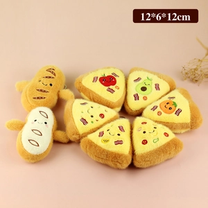 Cute plush food keychain set with pizza and baguette charms on a soft pink background