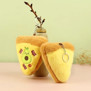 Detailed view of plush pizza keychain with avocado embroidery and silver metal ring