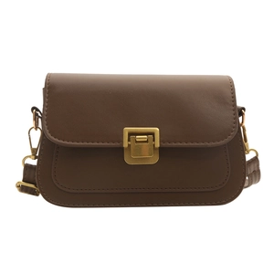 Retro brown saddle crossbody bag with a gold buckle on a clean white background