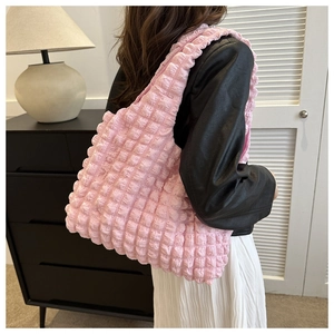 Detail of pink bubble texture cloud hobo bag on model for casual daily style