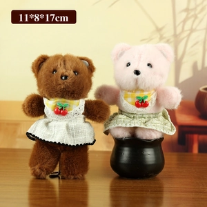 Cute teddy bear plush dolls in brown and pink colors with cherry bibs and plaid skirts